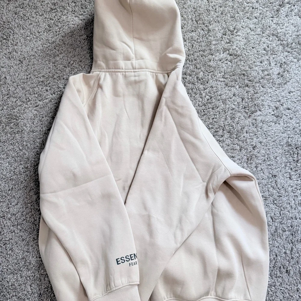 Essentials Men's Cream Hoodie with Black Logo - Picture 7 of 7